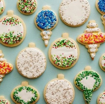 an array of cookies decorated as different Christmas onrmanents
                  